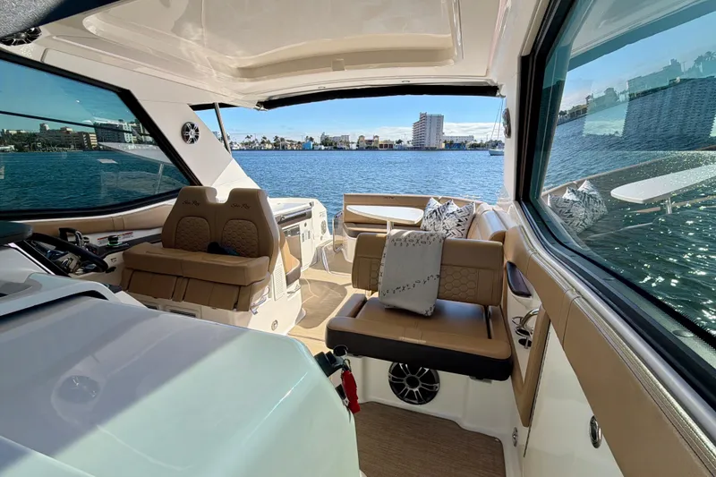 Slide: The Image of Interior of 2022 Sea Ray Sundancer 320 yacht with waterfront view. - 23