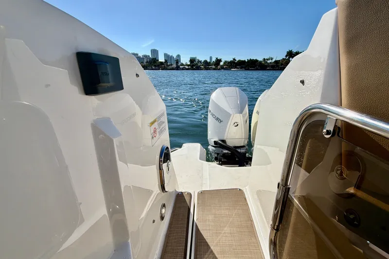 Slide: The Image of 2022 Sea Ray Sundancer 320 boat with Mercury outboard motor on a sunny day. - 32