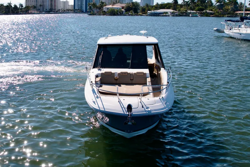 Slide: The Image of 2022 Sea Ray Sundancer 320 cruising on a sunny day in a scenic waterway. - 39