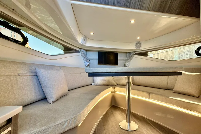 Slide: The Image of Luxurious interior of 2022 Sea Ray Sundancer 320 yacht with elegant seating and modern lighting. - 8