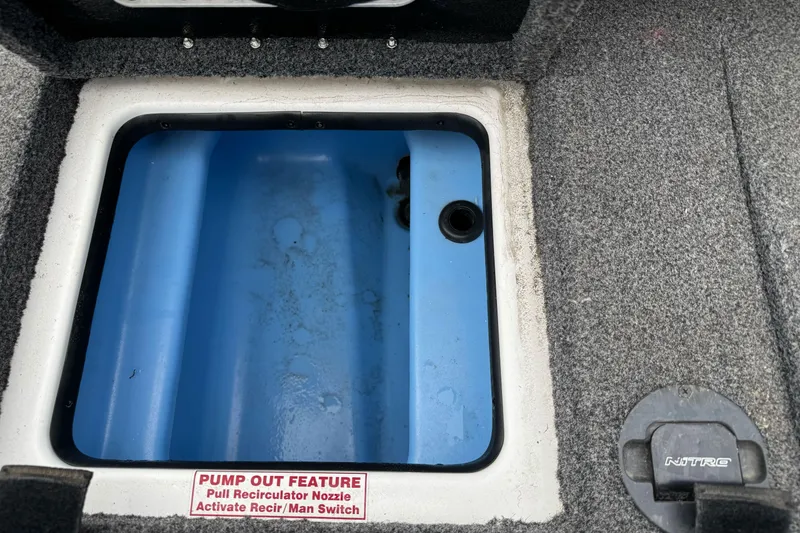 Slide: The Image of Open storage compartment in 2022 Nitro Z20 Pro boat with pump-out feature. - 17