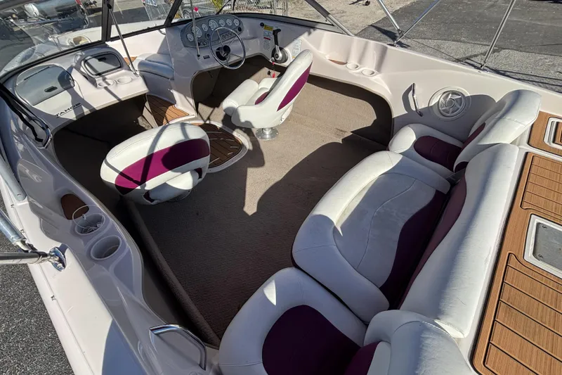 Slide: The Image of Interior of a 2008 Tahoe Q6 SF boat with white and purple seating. - 7