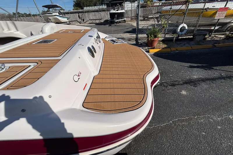 Slide: The Image of 2008 Tahoe Q6 SF boat with wooden deck, docked outdoors. - 8