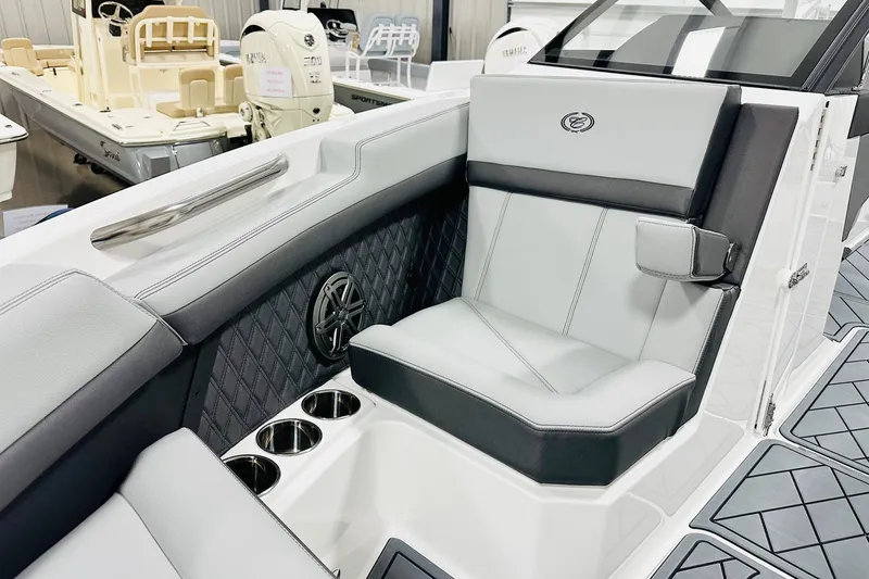 Slide: The Image of 2026 Cobalt R6 Outboard boat interior with luxurious seating and cup holders. - 8