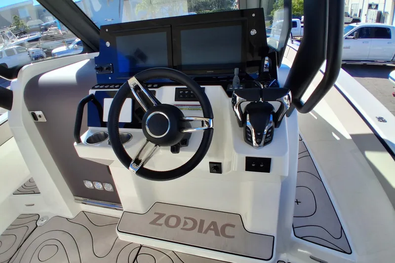 Slide: The Image of Cockpit of 2027 Zodiac X10CC boat with modern steering and controls. - 10