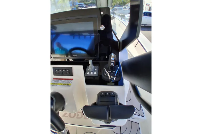 Slide: The Image of Control panel of 2027 Zodiac X10CC boat with navigation screen and joystick. - 12