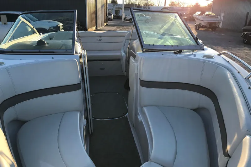 Slide: The Image of 2001 Four Winns 200 Horizon boat interior with white seating and open windshield. - 12