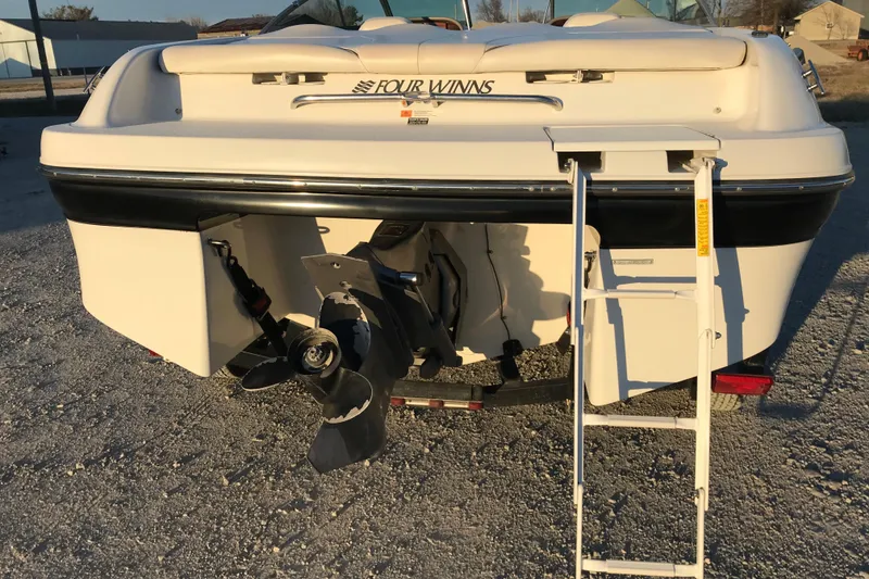 Slide: The Image of 2001 Four Winns 200 Horizon boat rear view with ladder and propeller. - 21