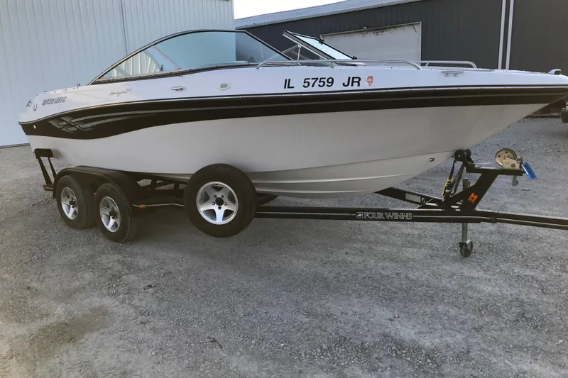Slide: The Image of 2001 Four Winns 200 Horizon boat on trailer, parked outdoors. - 22