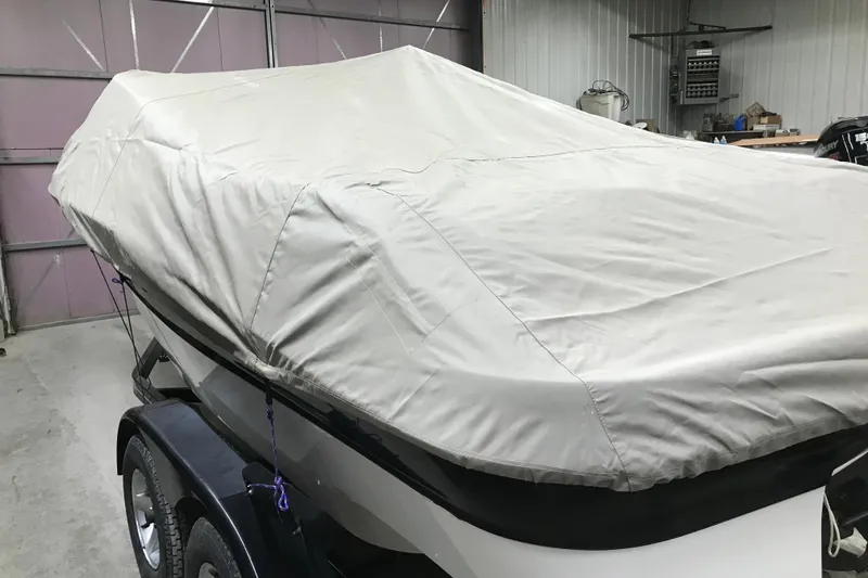 Slide: The Image of Covered 2001 Four Winns 200 Horizon boat on trailer in garage. - 28