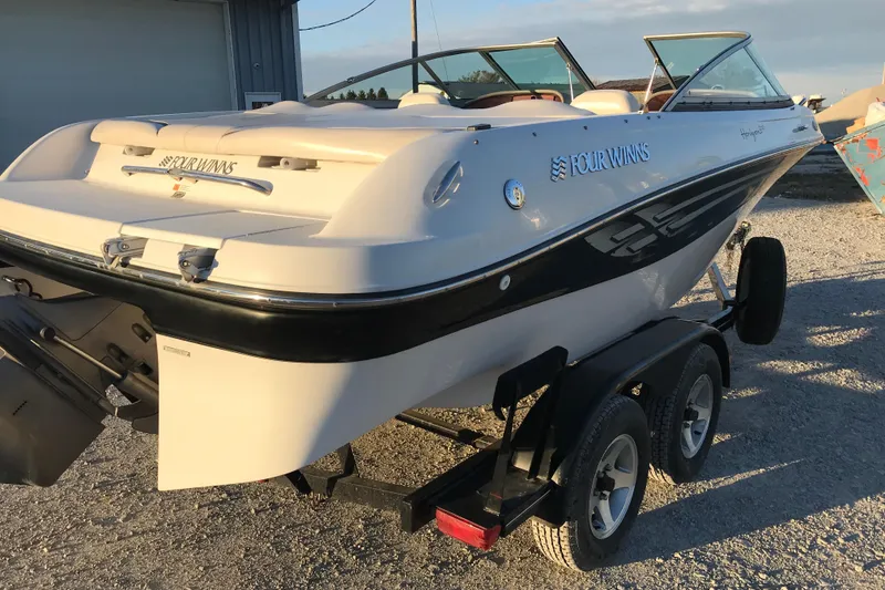 Slide: The Image of 2001 Four Winns 200 Horizon boat on trailer, parked outdoors. - 6