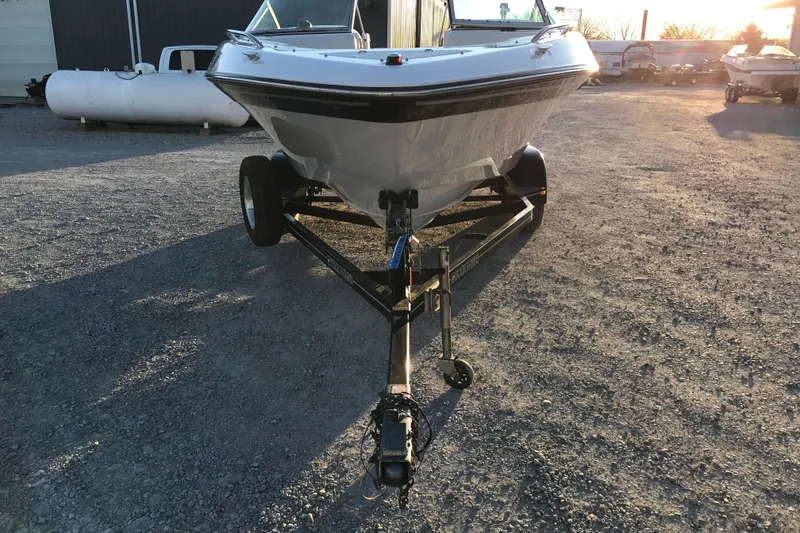 Slide: The Image of 2001 Four Winns 200 Horizon boat on trailer in outdoor setting. - 7