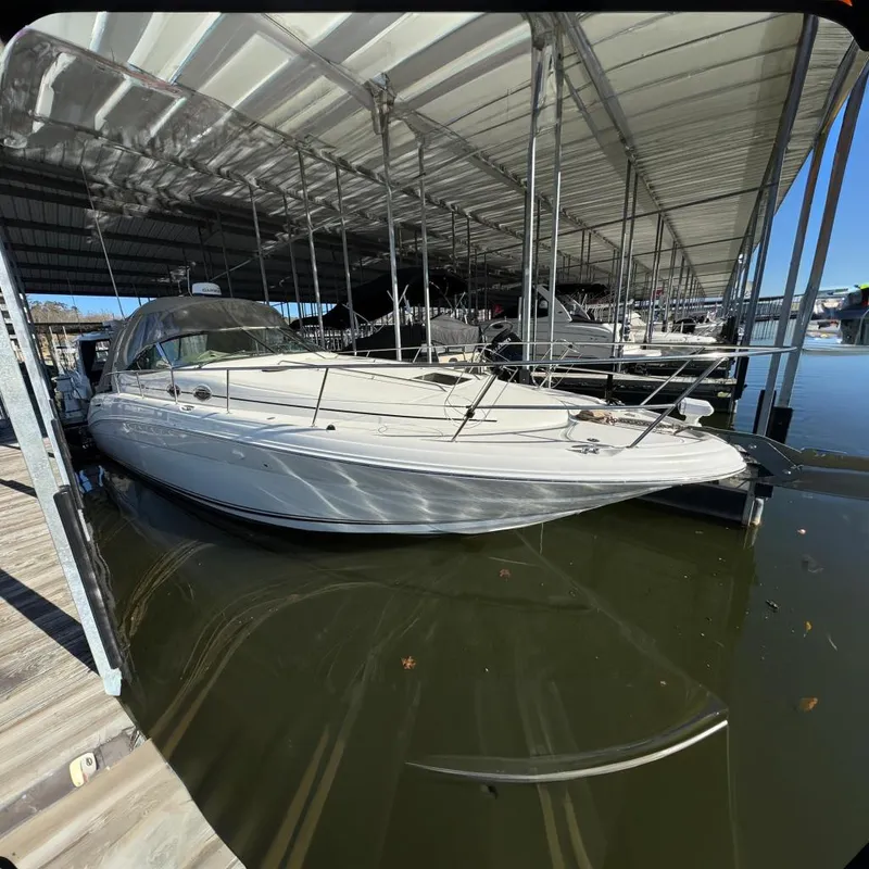 The Image of 2005 Sea Ray 360 Sundancer docked under covered slip. - 0