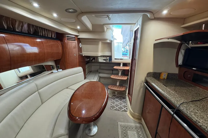 Slide: The Image of Luxurious interior of 2005 Sea Ray 360 Sundancer yacht with elegant seating and kitchenette. - 18