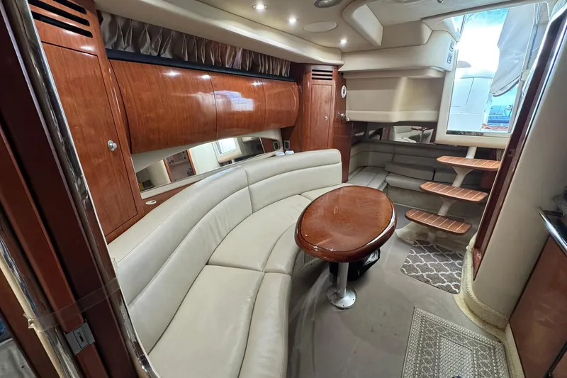 Slide: The Image of Luxurious interior of 2005 Sea Ray 360 Sundancer yacht with elegant seating and wooden accents. - 19