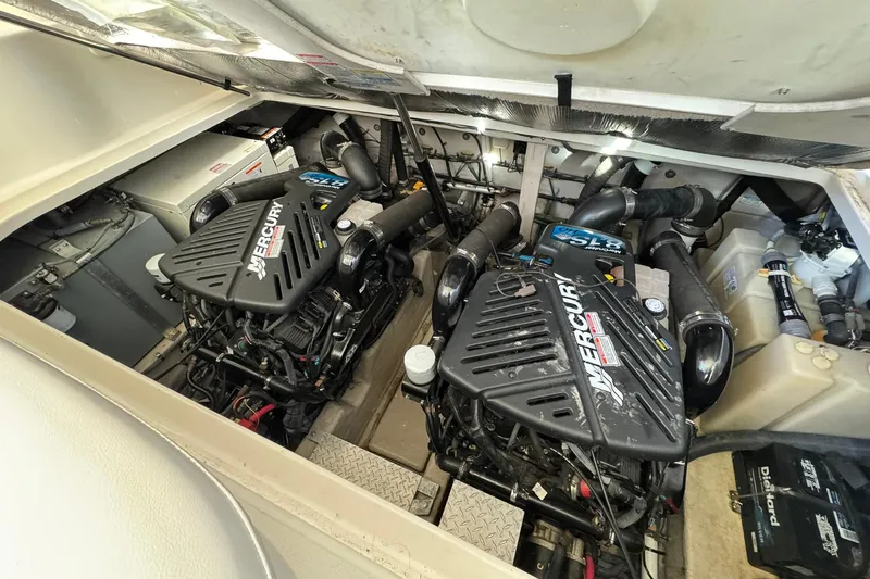 Slide: The Image of Engine compartment of a 2005 Sea Ray 360 Sundancer with twin Mercury engines. - 22
