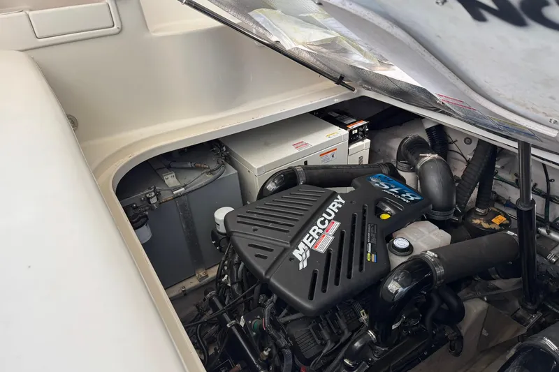 Slide: The Image of Engine compartment of 2005 Sea Ray 360 Sundancer with Mercury engine visible. - 23