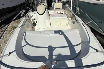 Slide: The Image of 2018 Boston Whaler 170 Super Sport boat interior with seating and steering console. - 14