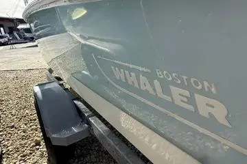 Slide: The Image of 2018 Boston Whaler 170 Super Sport boat on trailer, side view. - 17