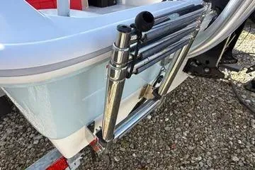 Slide: The Image of 2018 Boston Whaler 170 Super Sport boat ladder on gravel surface. - 22