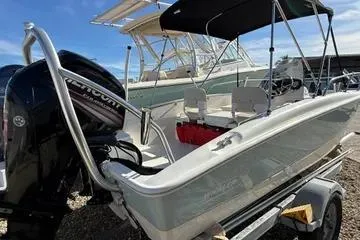 Slide: The Image of 2018 Boston Whaler 170 Super Sport boat on trailer, featuring sleek design and powerful engine. - 26