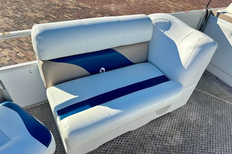 Slide: The Image of 2004 Crest 2200 Family DL boat seat with blue and beige upholstery. - 16
