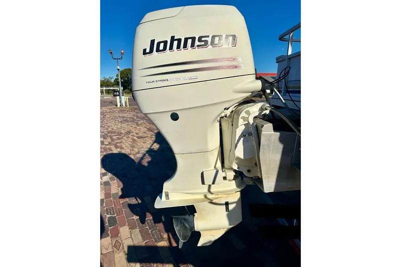 Slide: The Image of 2004 Crest 2200 Family DL with Johnson outboard motor, four-stroke engine. - 8