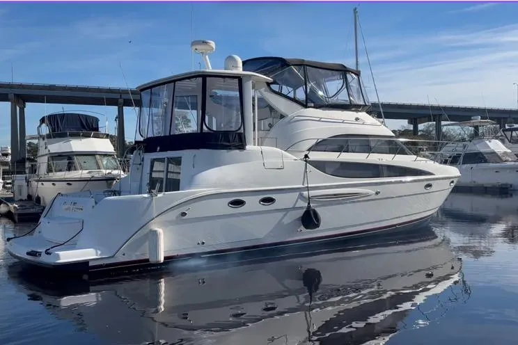 The Image of 2004 Meridian 459 Motoryacht docked, sleek design. - 0