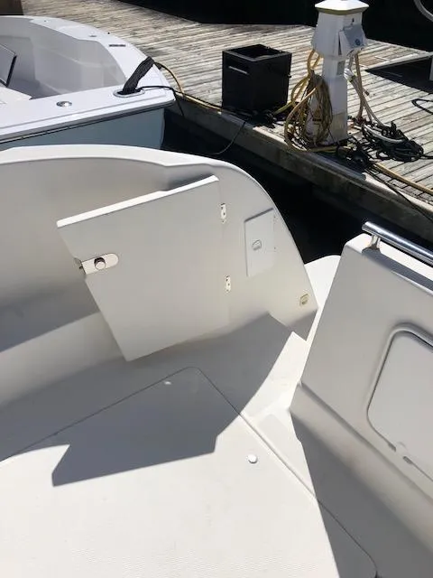 Slide: The Image of 2004 Meridian 459 Motoryacht deck with open hatch, dockside view. - 25