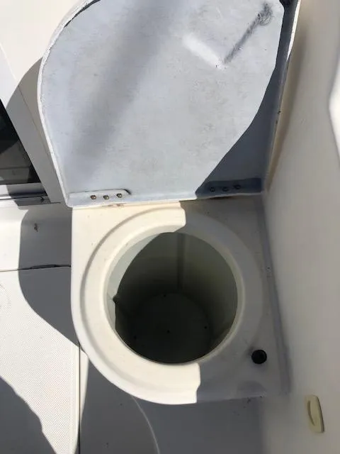 Slide: The Image of Open toilet seat on 2004 Meridian 459 Motoryacht. - 26