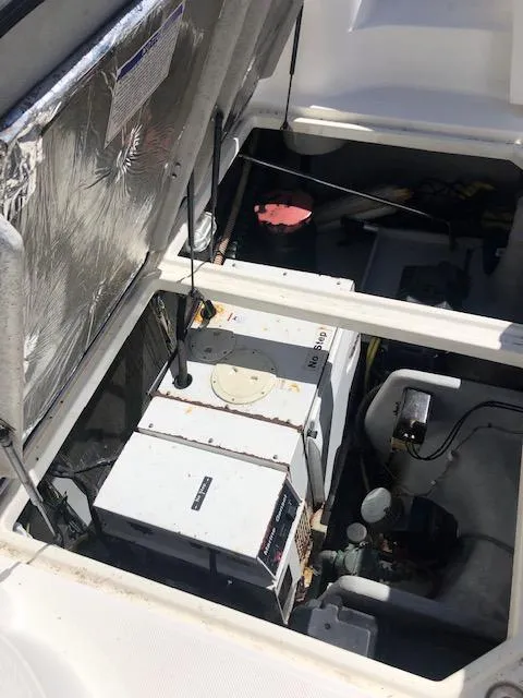 Slide: The Image of Engine compartment of a 2004 Meridian 459 Motoryacht, showcasing mechanical components. - 29