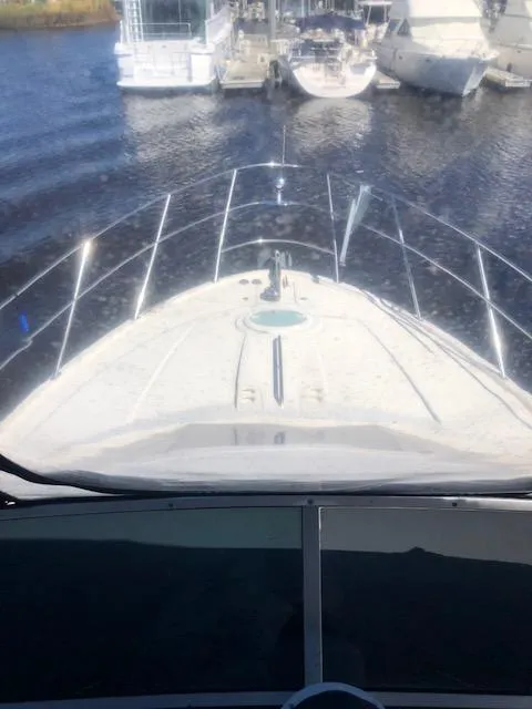 Slide: The Image of 2004 Meridian 459 Motoryacht on calm water, docked at marina. - 32