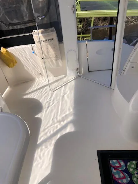 Slide: The Image of Interior view of 2004 Meridian 459 Motoryacht with open door and seating area. - 33