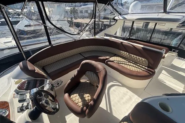 Slide: The Image of Luxurious interior of 2004 Meridian 459 Motoryacht with plush seating and steering wheel. - 7