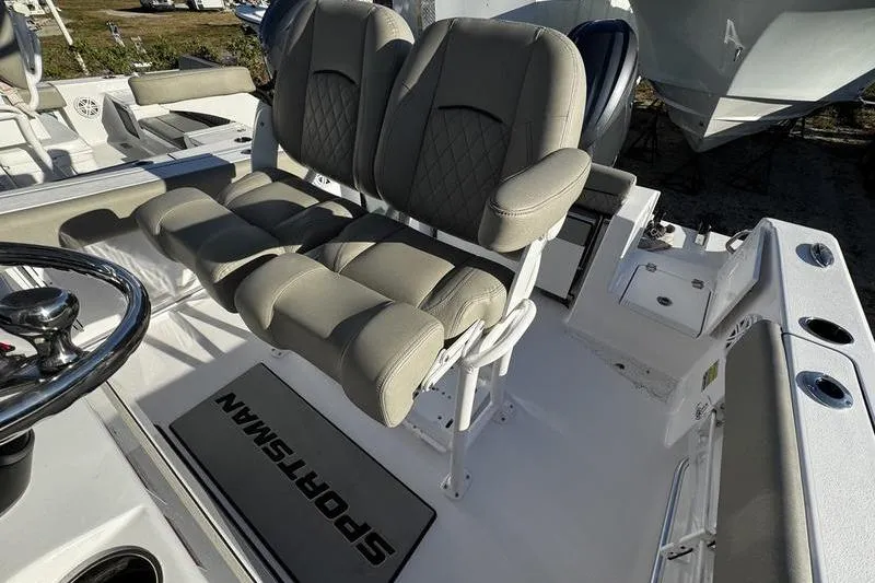 Slide: The Image of 2026 Sportsman Open 212 Center Console boat interior with dual seats and steering wheel. - 16