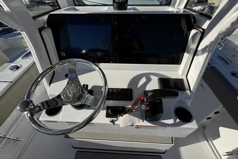 Slide: The Image of 2026 Sportsman Open 212 Center Console dashboard with steering wheel and controls. - 18
