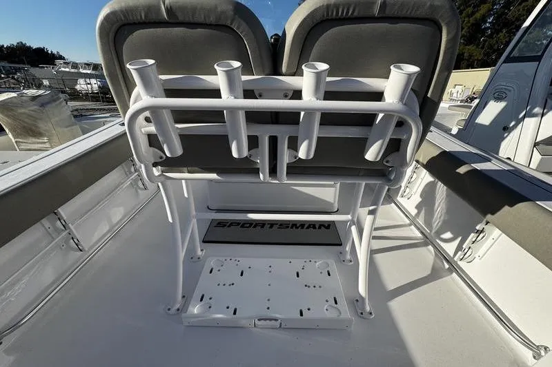 Slide: The Image of 2026 Sportsman Open 212 Center Console boat interior with rod holders and seating. - 21
