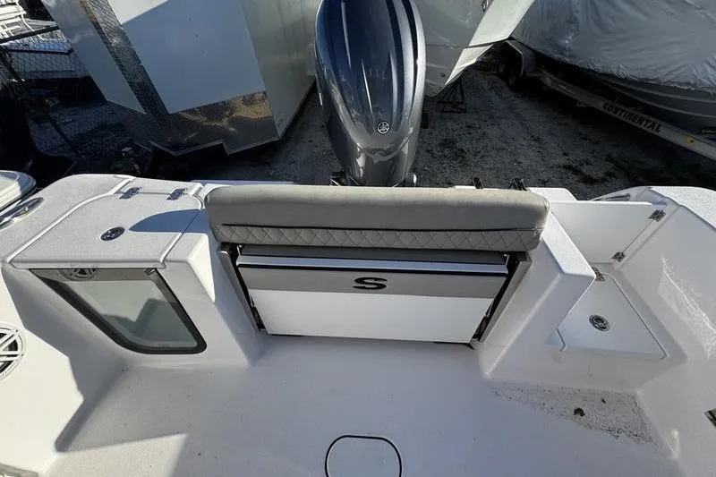 Slide: The Image of 2026 Sportsman Open 212 Center Console boat interior with seating and engine view. - 22