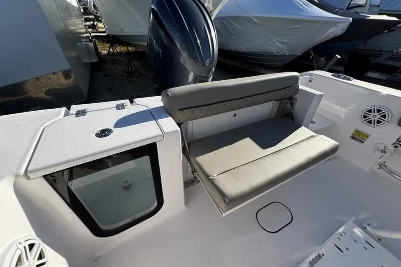 Slide: The Image of 2026 Sportsman Open 212 Center Console boat interior with seating and storage. - 23