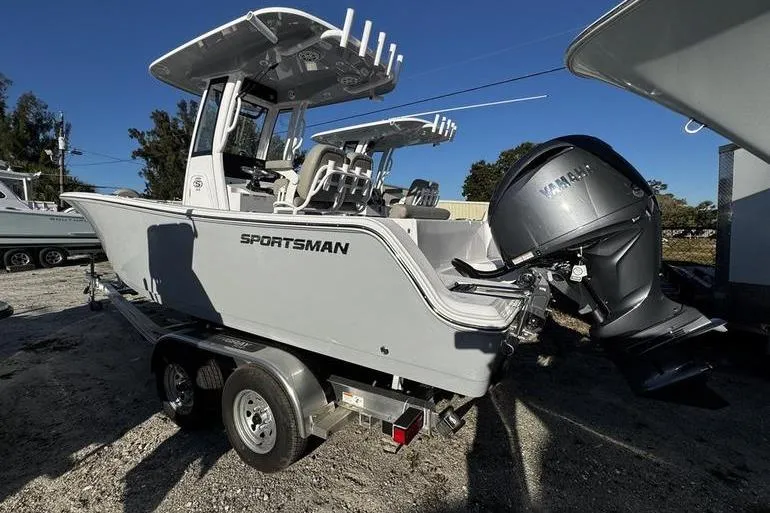 Slide: The Image of 2026 Sportsman Open 212 Center Console boat on trailer, featuring Yamaha outboard motor. - 26