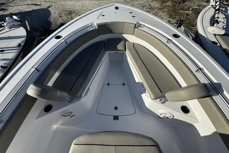 Slide: The Image of 2026 Sportsman Open 212 Center Console boat interior with cushioned seating and storage. - 4