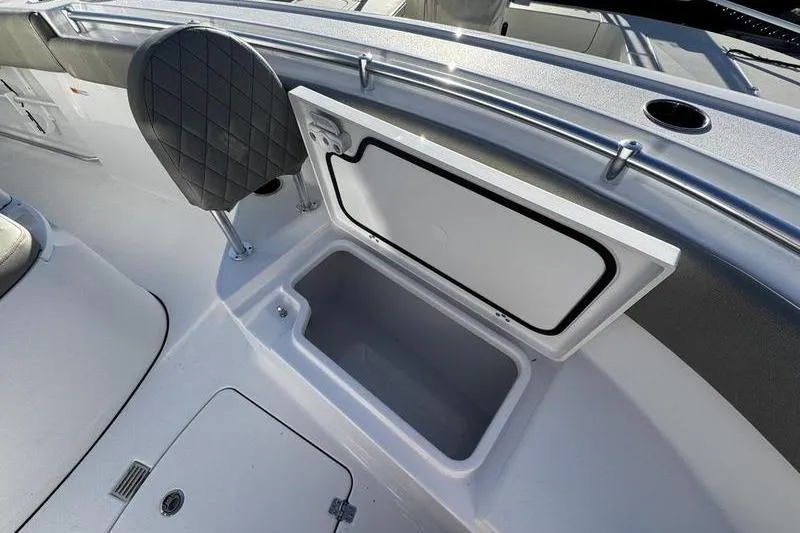 Slide: The Image of 2026 Sportsman Open 212 Center Console boat with open storage compartment. - 7