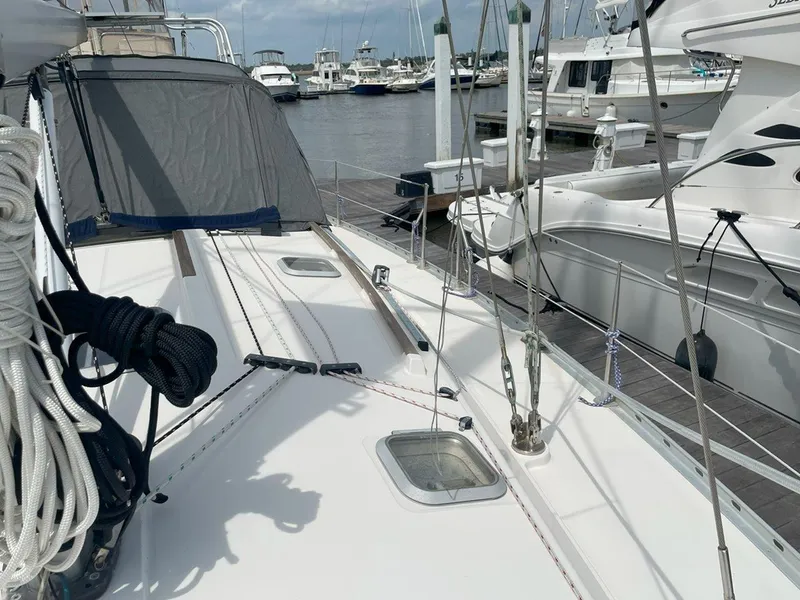Slide: The Image of Deck view of 1998 Jeanneau Sun Odyssey 45.2 sailboat docked at marina. - 14