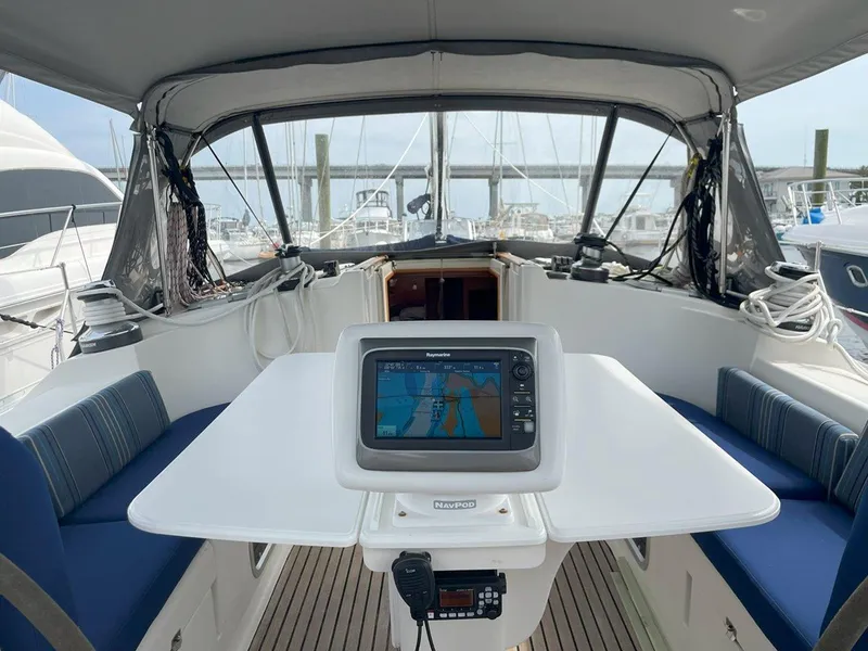 Slide: The Image of Cockpit of 1998 Jeanneau Sun Odyssey 45.2 sailboat with navigation system and seating. - 16