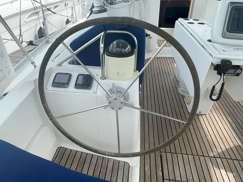 Slide: The Image of Steering wheel of 1998 Jeanneau Sun Odyssey 45.2 sailboat with wooden deck. - 19