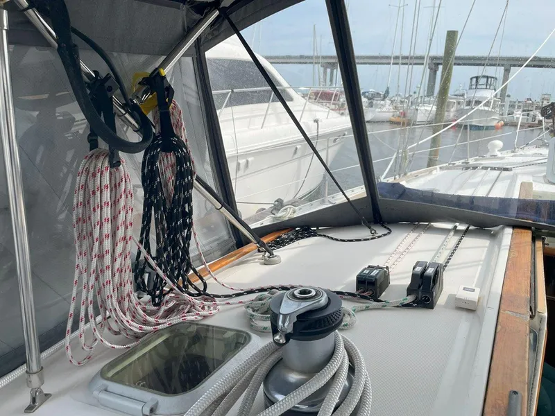 Slide: The Image of Cockpit view of 1998 Jeanneau Sun Odyssey 45.2 sailboat with ropes and winch. - 21
