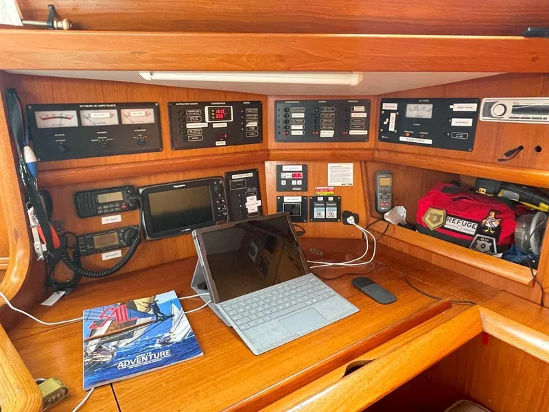 Slide: The Image of Navigation station on 1998 Jeanneau Sun Odyssey 45.2 yacht with electronics and tablet. - 28