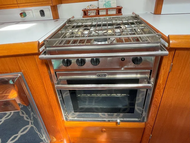 Slide: The Image of Stainless steel stove and oven in Jeanneau Sun Odyssey 45.2 yacht kitchen, 1998 model. - 31