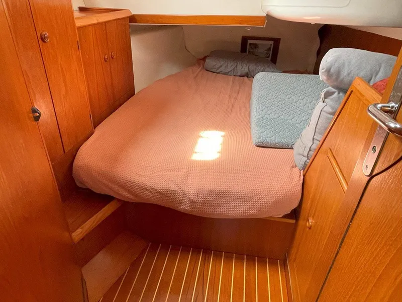Slide: The Image of Cozy cabin interior of 1998 Jeanneau Sun Odyssey 45.2 sailboat with wooden furnishings. - 37