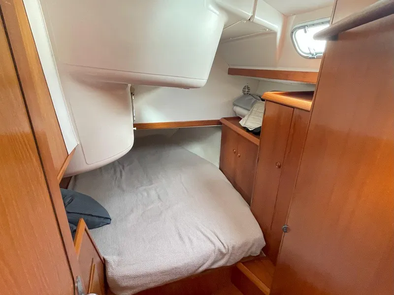 Slide: The Image of Cozy cabin interior of 1998 Jeanneau Sun Odyssey 45.2 sailboat with wooden furnishings. - 38